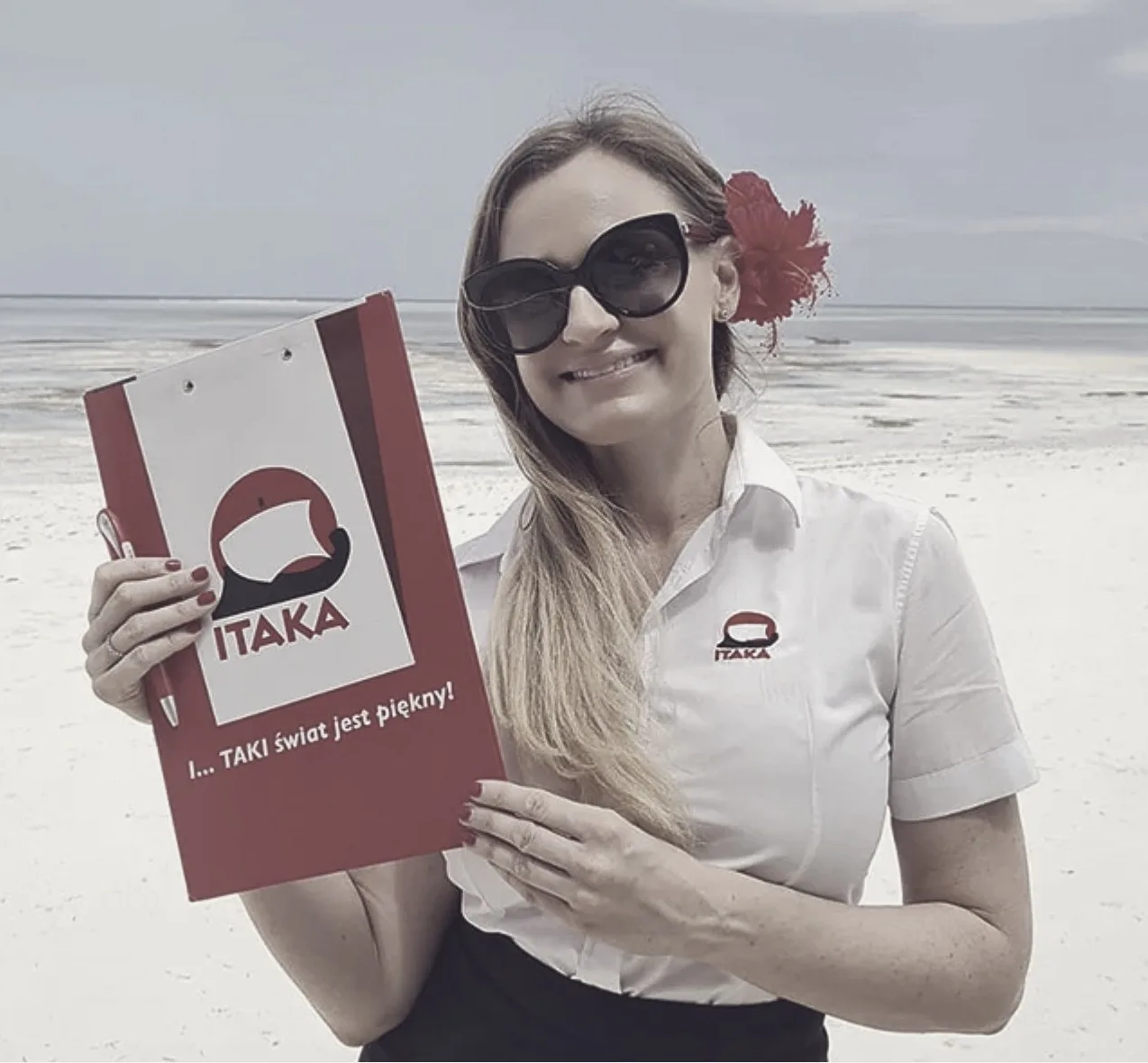 A destination rep with the printed Itaka clipboard and pen — the guest-facing job, and the paper tool, that no one had yet designed for.
